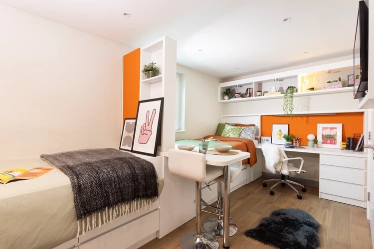 Two beds desk chair shelving unit student room at Drapery Place in London Student Accommodation