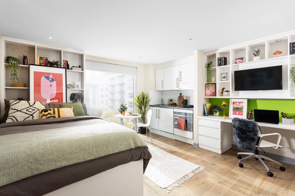 Bed kitchen desk and TV studio apartment at Drapery Place in London Student Accommodation
