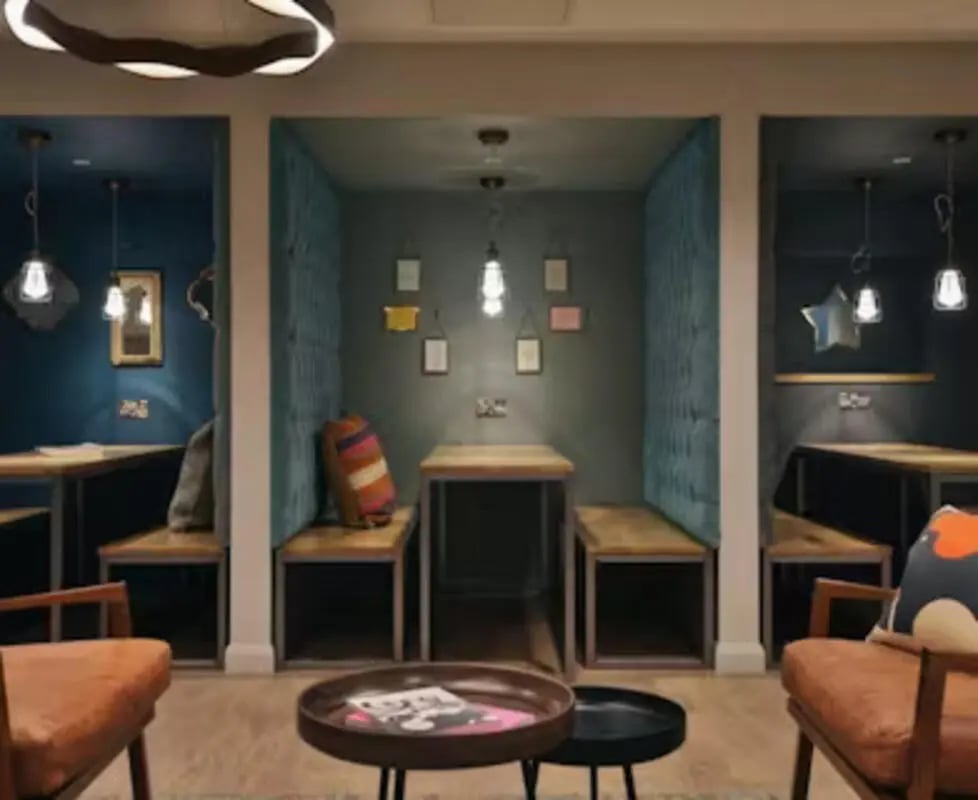 Booths with tables chairs and lamps study area at College Green in Bristol Student Accommodation