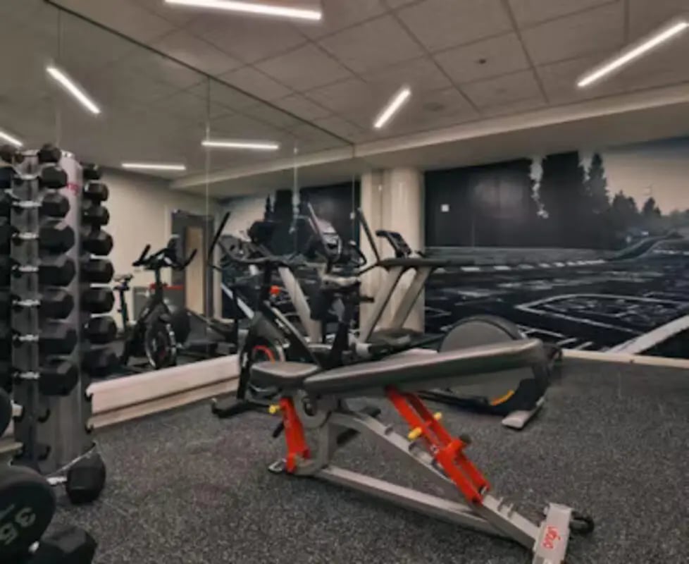 Dumbbells exercise bikes treadmill weight bench fitness gym at College Green in Bristol Student Accommodation