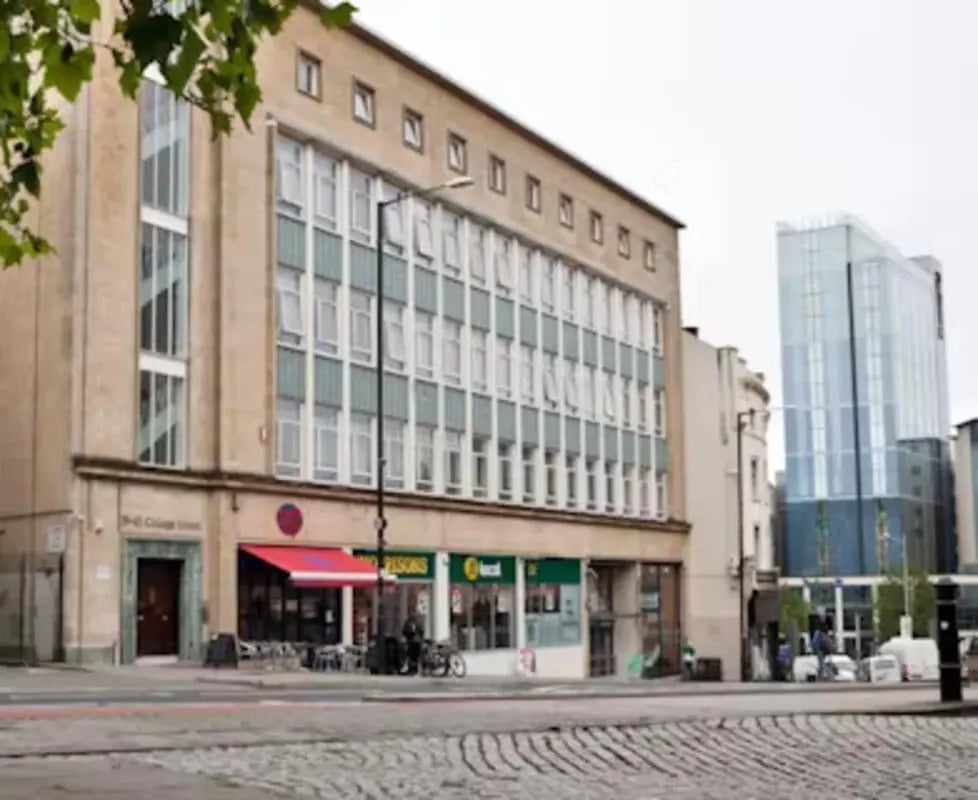 Apartment building with shops on ground floor exterior at College Green in Bristol Student Accommodation