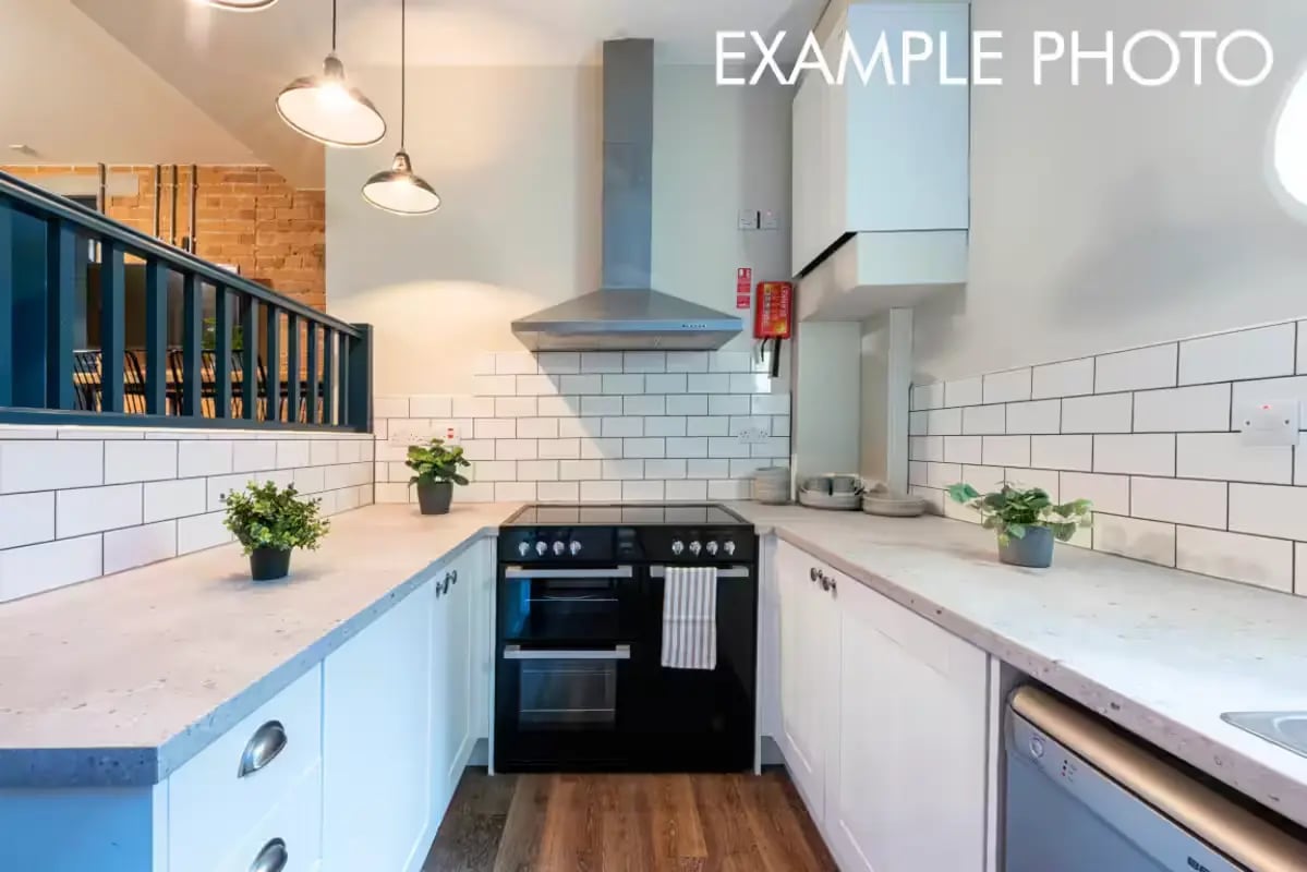 Modern kitchen with black oven and white cabinets Kitchen at The Shoe & Boot Factory in Leicester Student Accommodation