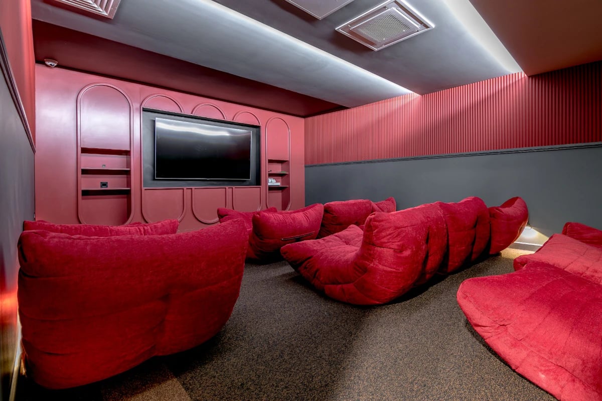 Red beanbags and television in cinema room at 79 Silver Street in Reading Student Accommodation