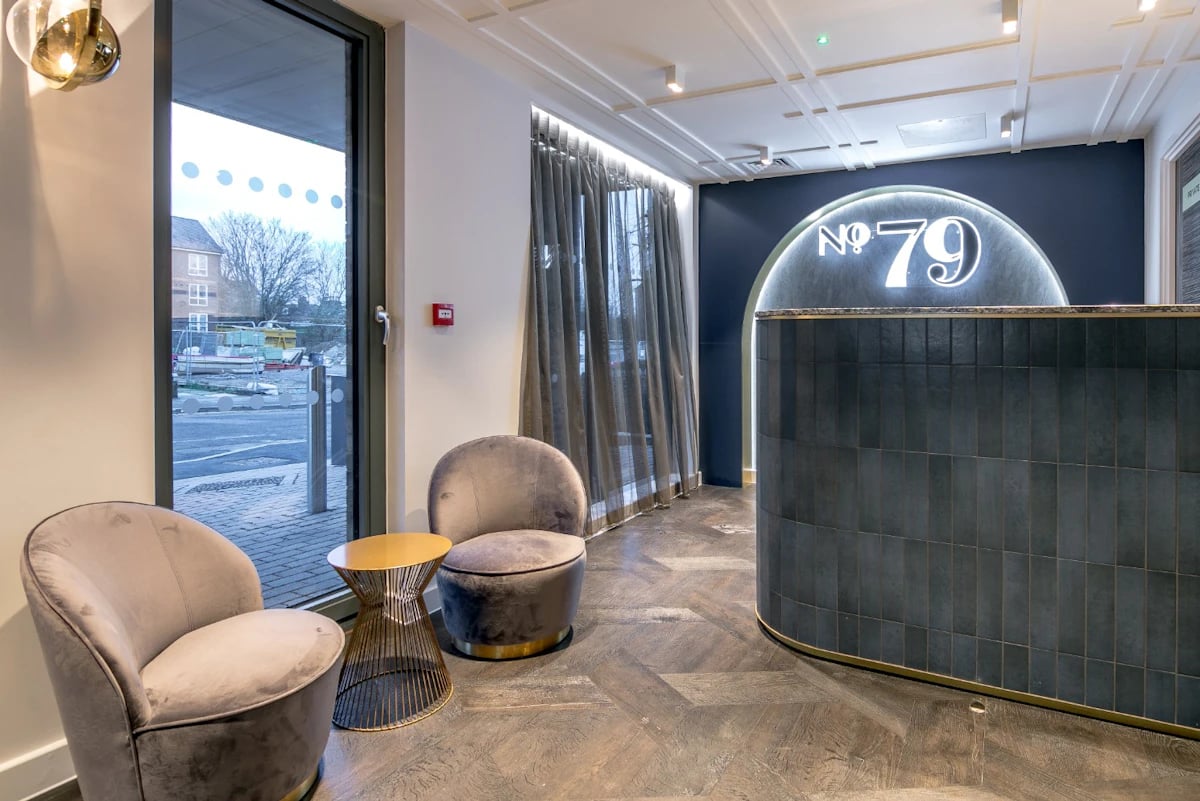 Grey chairs and gold table reception desk at 79 Silver Street in Reading Student Accommodation