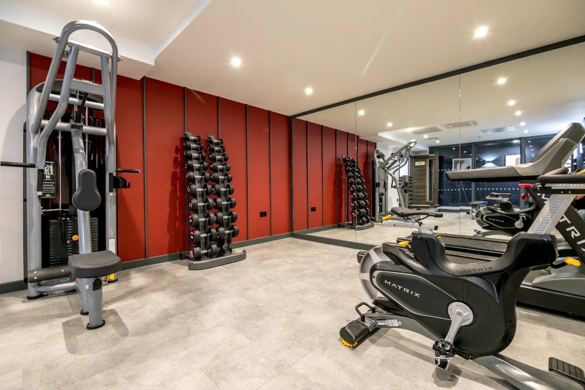 Dumbbell racks exercise machine treadmill gym area at 79 Silver Street in Reading Student Accommodation