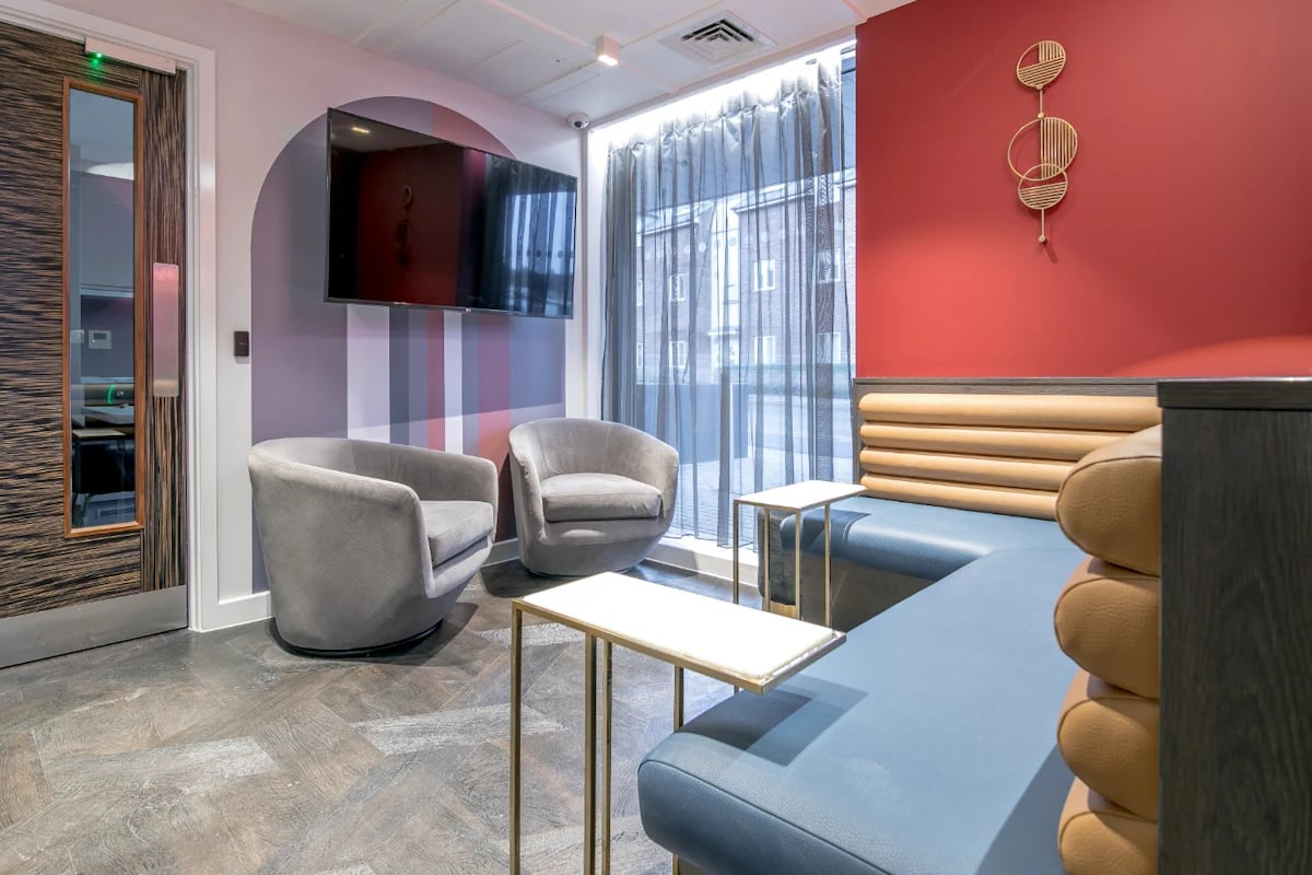 Modern seating area with TV and accent wall at 79 Silver Street in Reading Student Accommodation