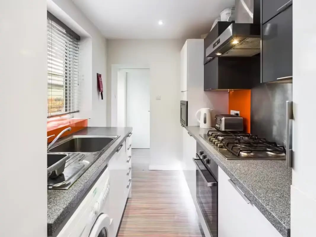 Sink washing machine hob toaster kettle kitchen at 219 Leek Road in Stoke-On-Trent Student Accommodation