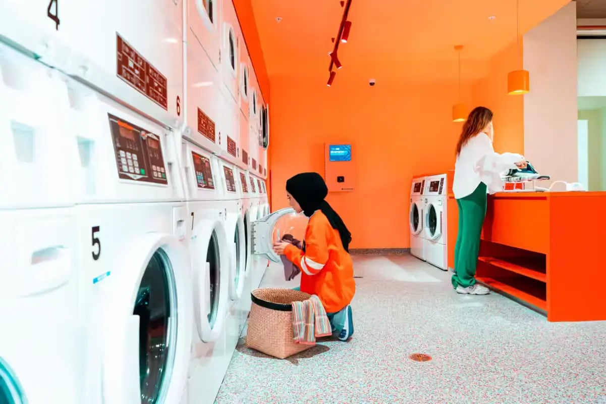 Washing machines laundry basket ironing board laundry area at Scape Lincoln College in Melbourne Student Accommodation