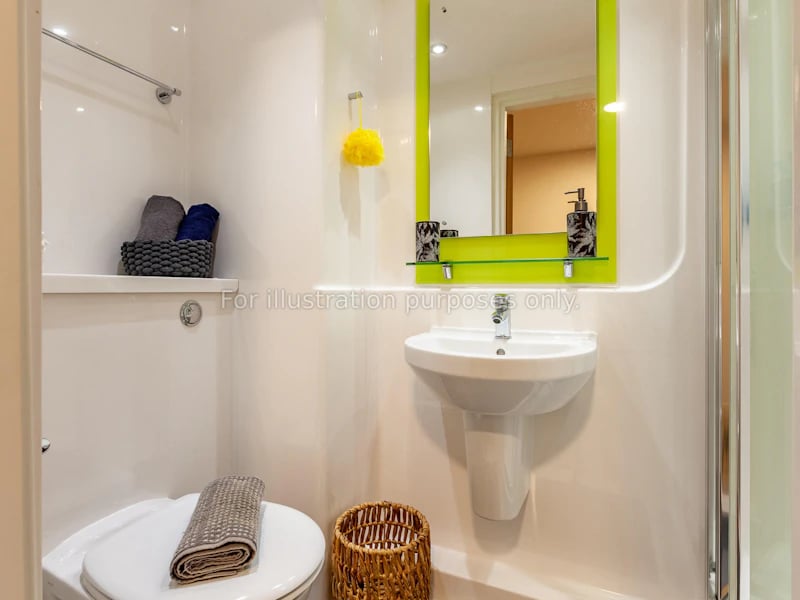 Toilet sink mirror basket towels bathroom at Hannah Court in Sheffield Student Accommodation