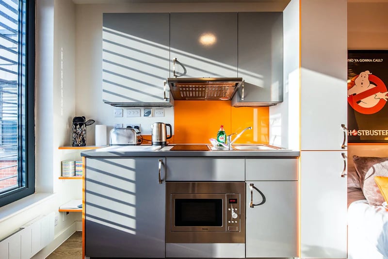 Small kitchen with microwave toaster kettle sink kitchen area at Hannah Court in Sheffield Student Accommodation