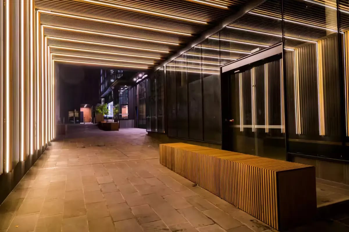Modern entrance with wood bench and lighting Exterior at Scape La Trobe in Melbourne Student Accommodation