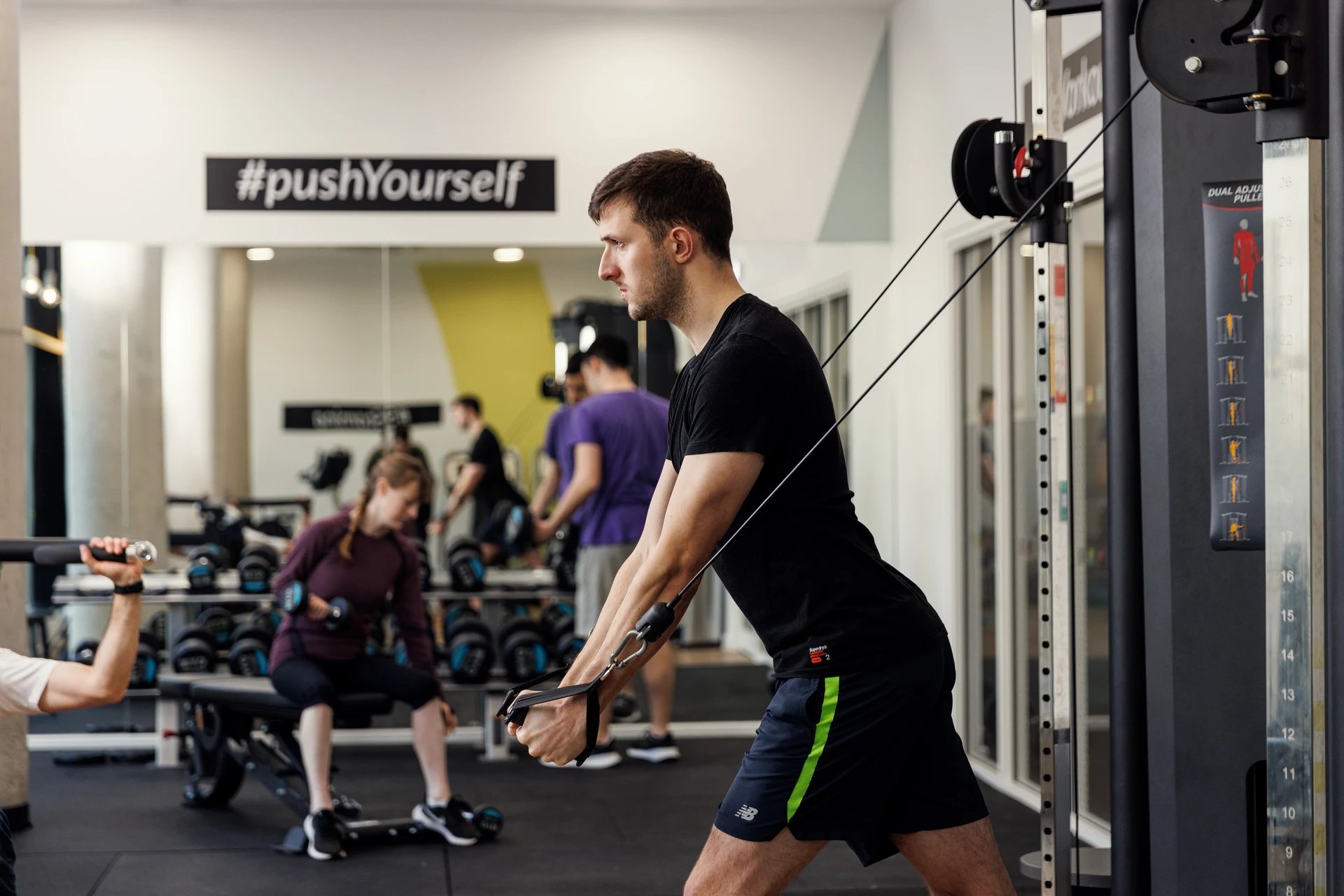 Gym with people exercising and weight racks gym at Chaucer House in Portsmouth Student Accommodation