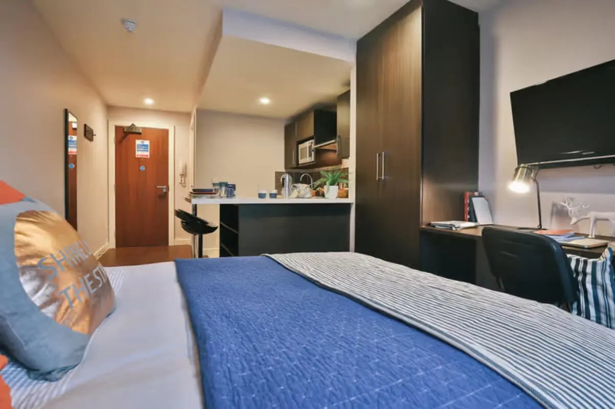 Bed kitchen counter desk and wardrobe studio apartment at Talbot Studios in Nottingham Student Accommodation