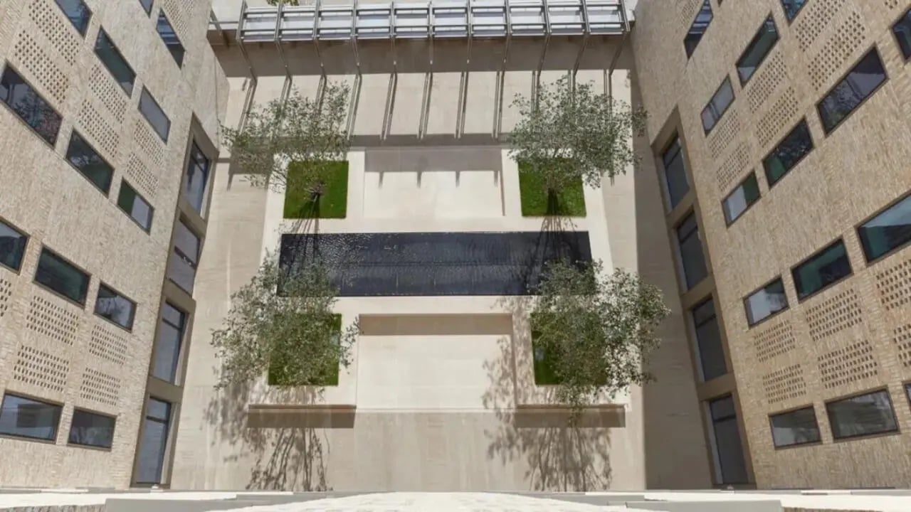 Courtyard with trees grass and water feature exterior at Victoria Hall Kings Cross in London Student Accommodation