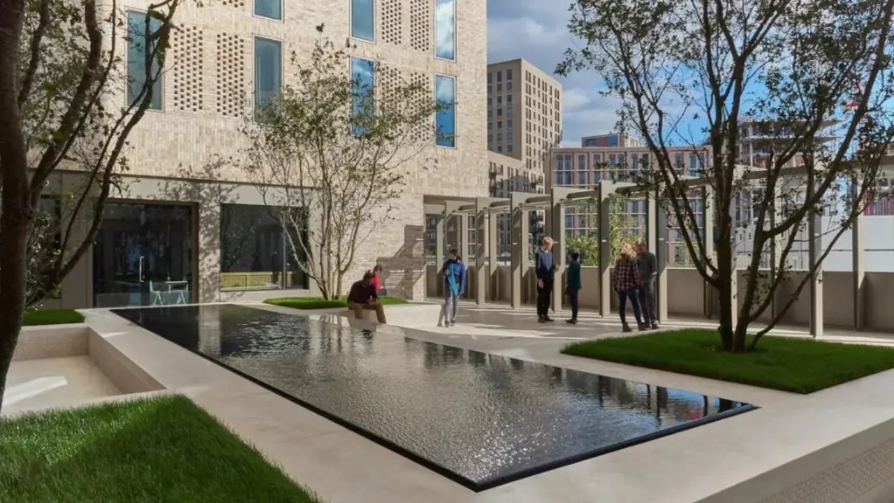 Courtyard with people and water feature exterior at Victoria Hall Kings Cross in London Student Accommodation