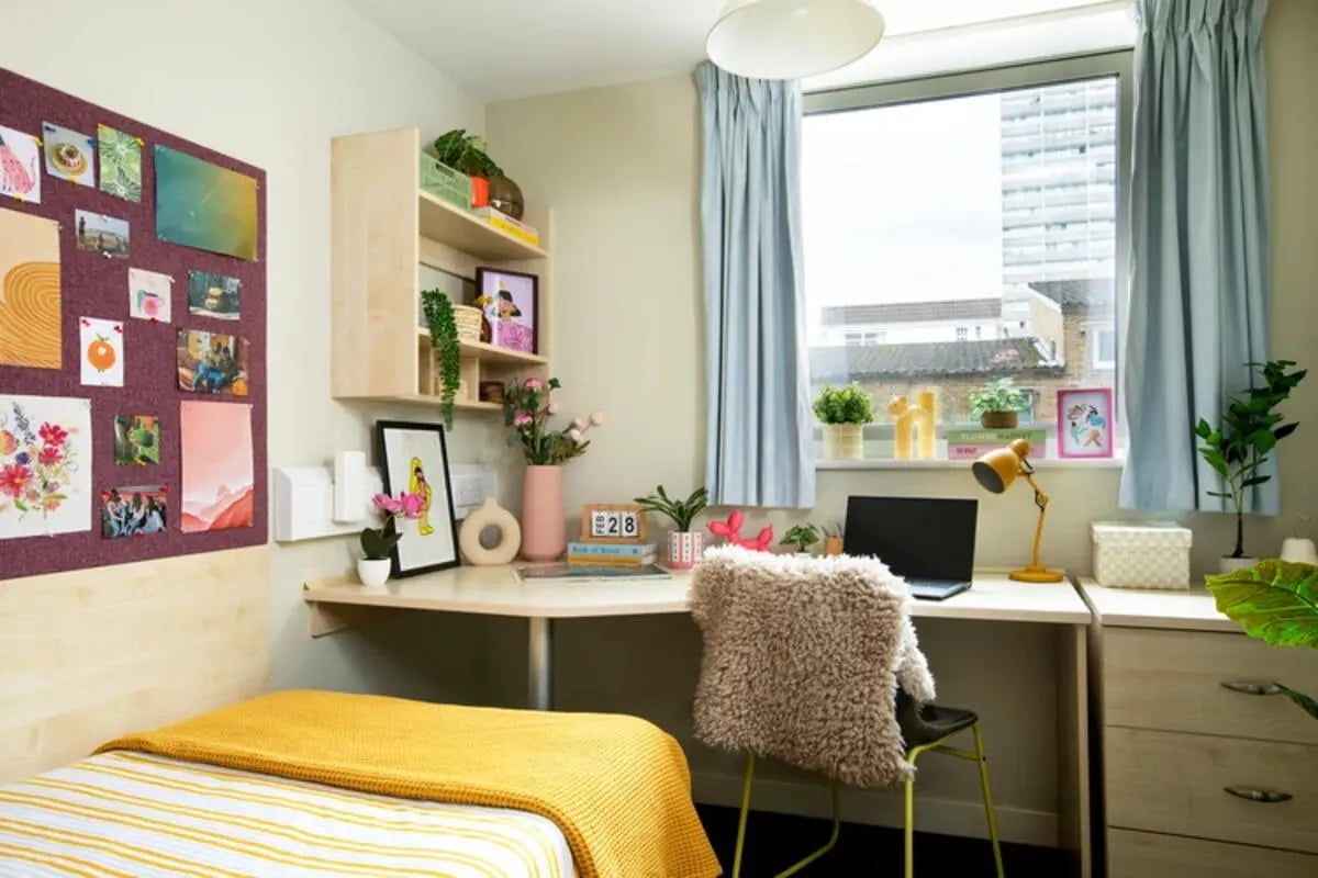 Bed desk chair and shelf bedroom at Quantum Court in London Student Accommodation