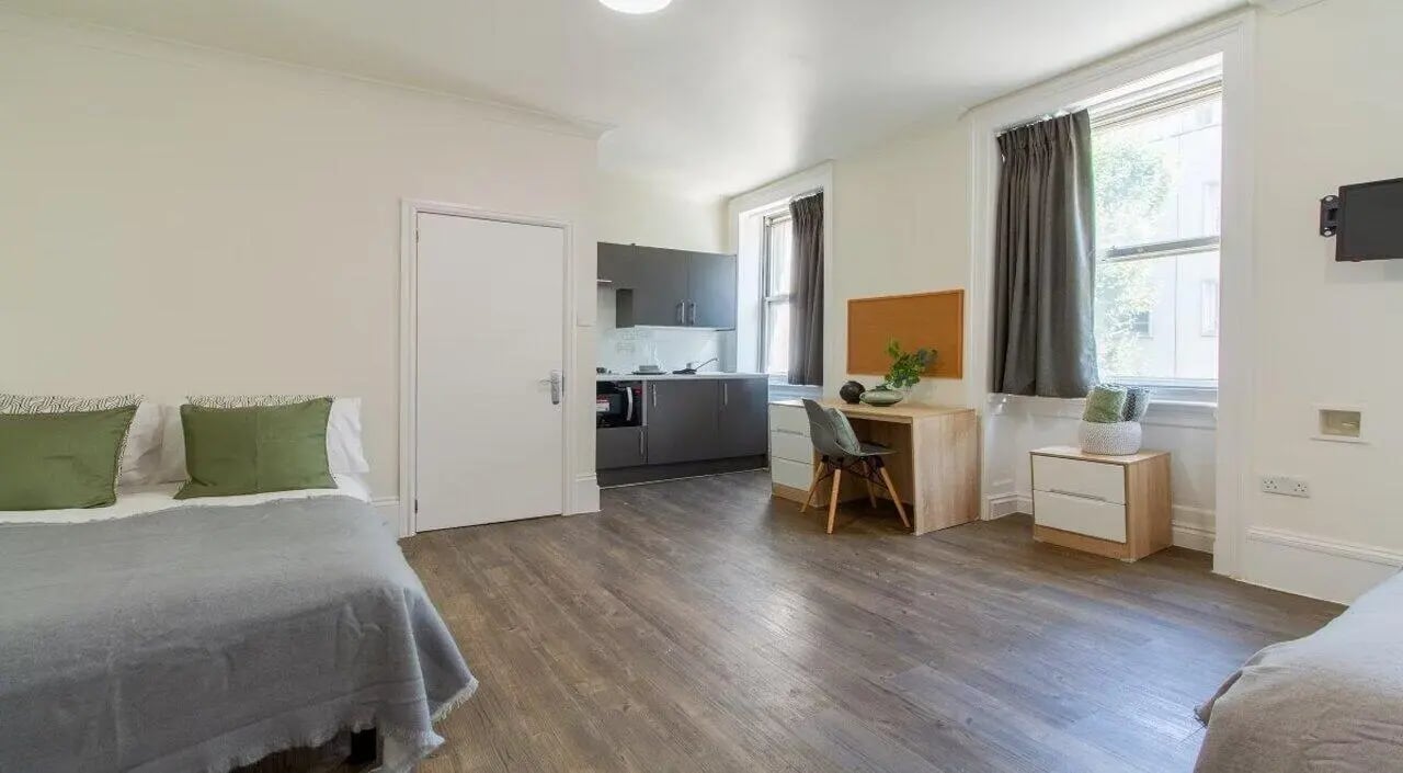 Bed kitchen desk and bed studio apartment at Bloomsbury Janet Poole House in London Student Accommodation