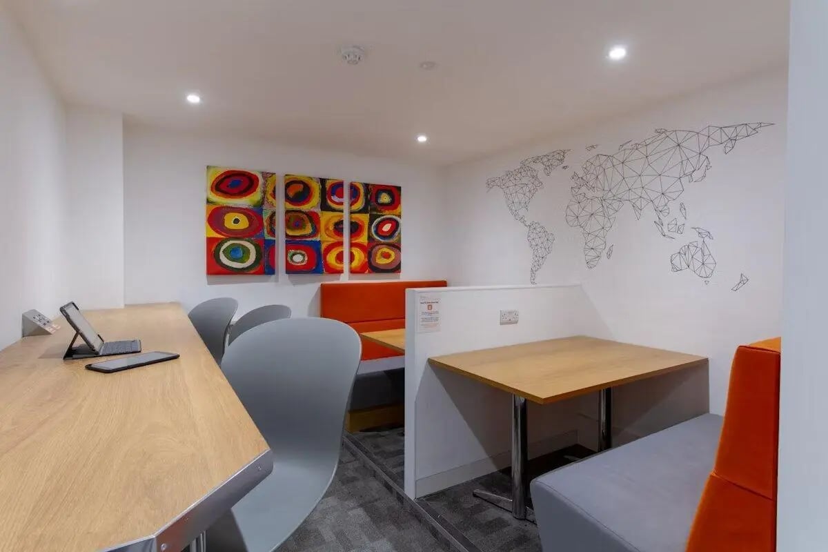 Booths with art and world map study area at Bloomsbury Janet Poole House in London Student Accommodation