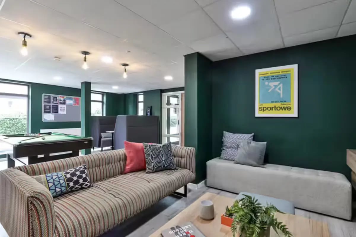 Sofa pool table booth seating common area living room at Foss Studios in York Student Accommodation