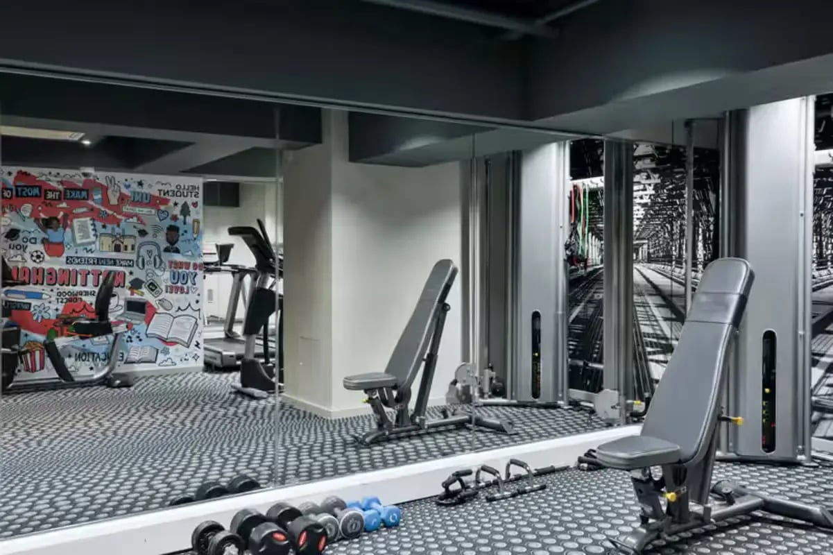 Dumbbells treadmills weight benches gym area at The Frontage in Nottingham Student Accommodation