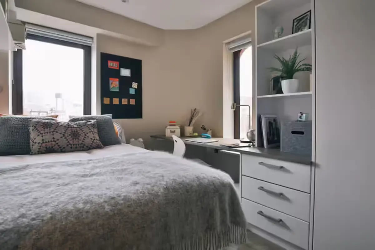 Bed desk and shelves in student room at The Frontage in Nottingham Student Accommodation
