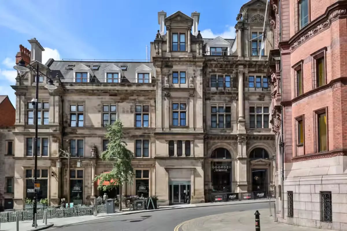 Stone building windows signs and street exterior at The Frontage in Nottingham Student Accommodation