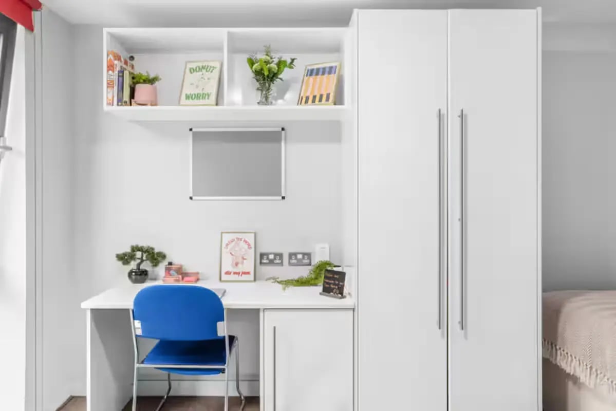 Desk chair whiteboard shelves and wardrobe bedroom at Alwyn Court in Cardiff Student Accommodation