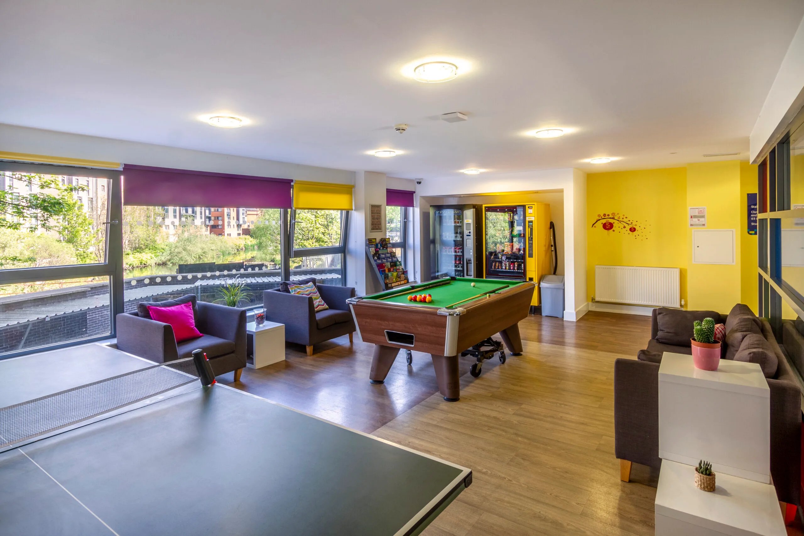Pool table chairs vending machines lounge area at Kaplan Living Glasgow - Argyle Street in Glasgow Student Accommodation