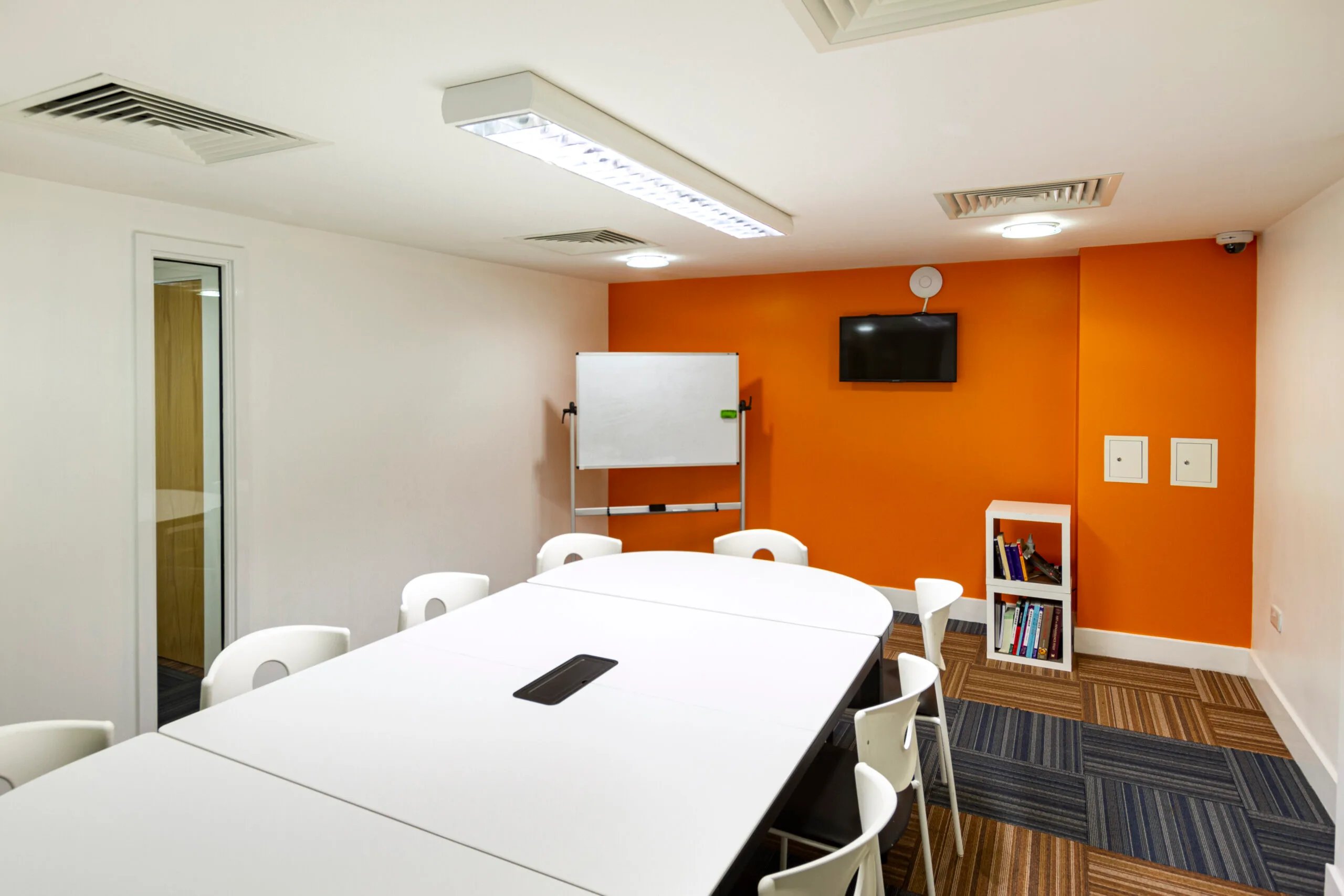 White table chairs whiteboard TV study area at Kaplan Living Glasgow - Argyle Street in Glasgow Student Accommodation