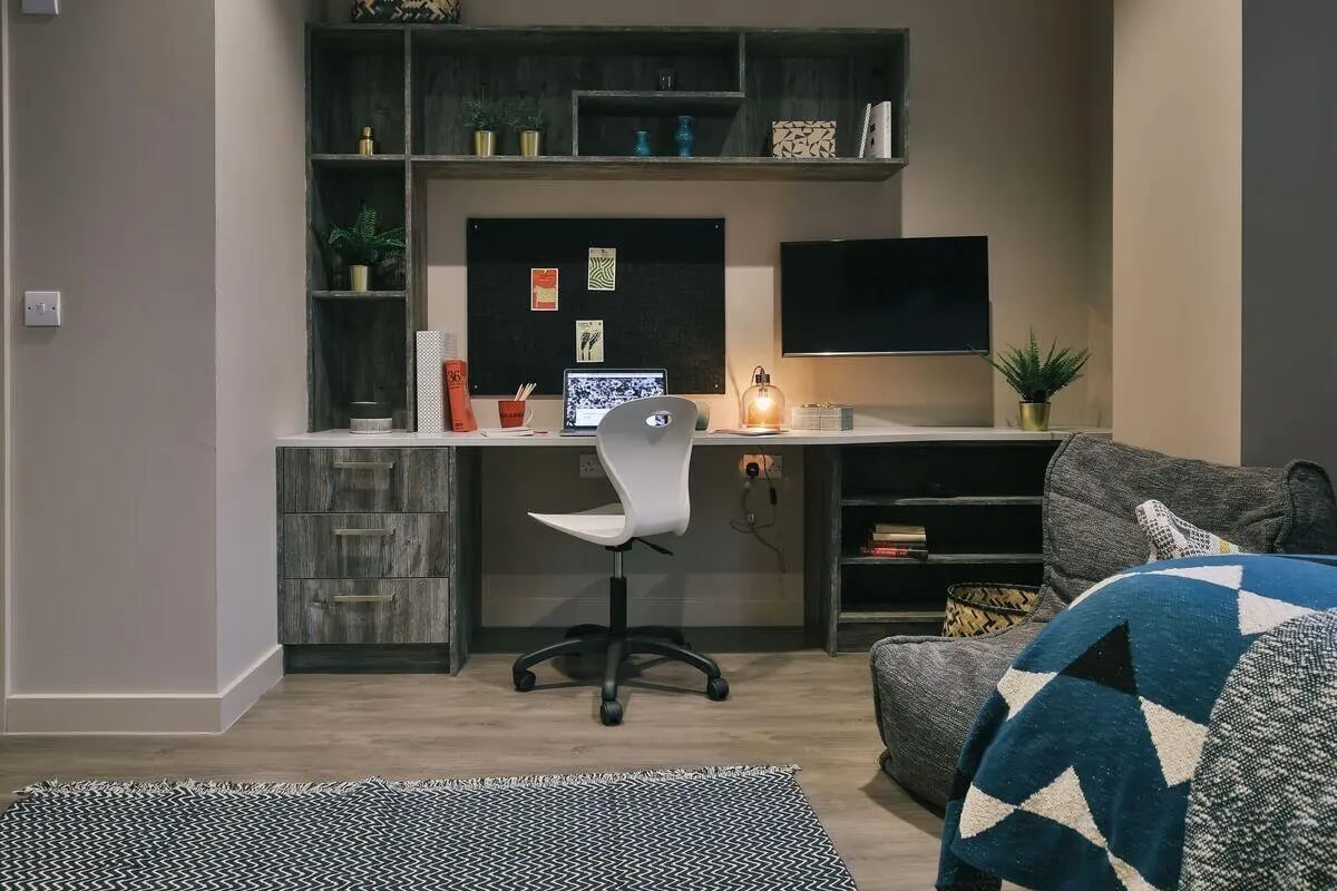 Desk with laptop TV and chair study area at Bath Street in Glasgow Student Accommodation