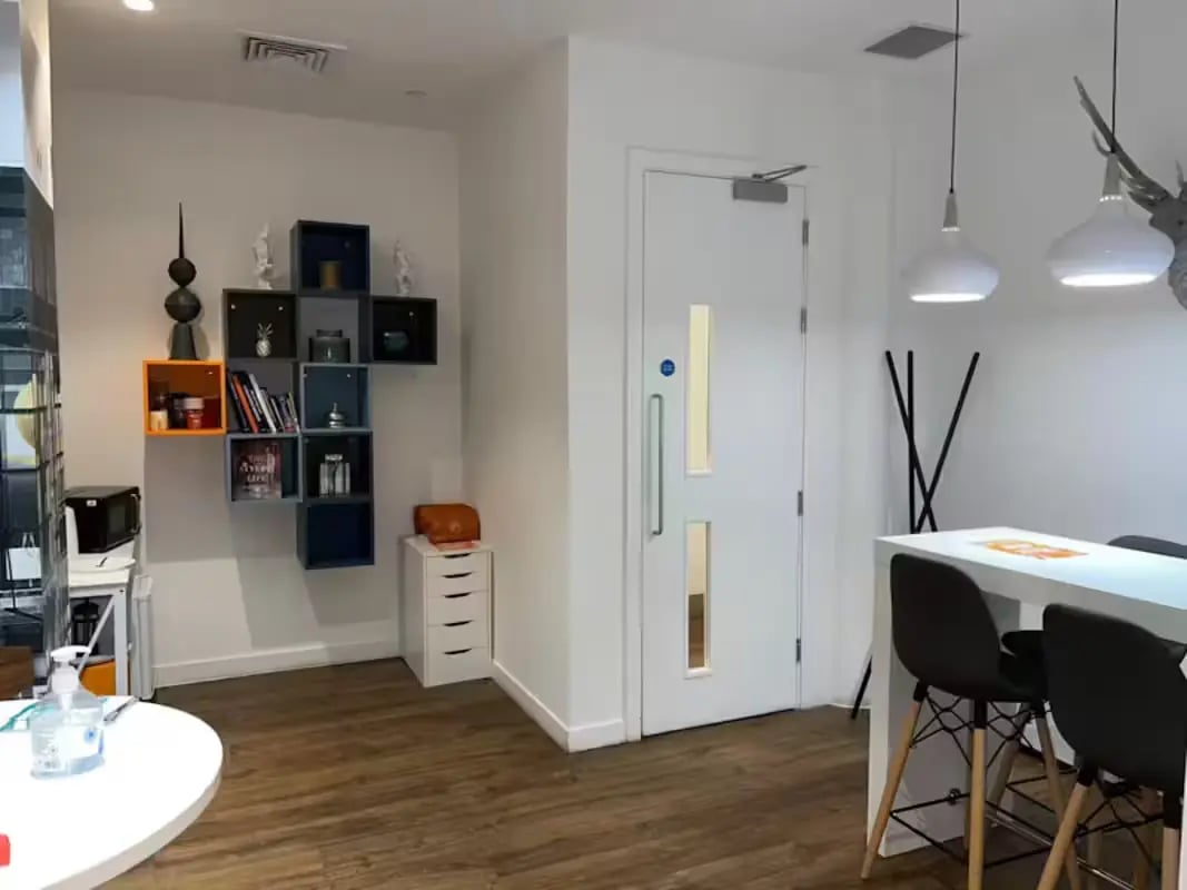 Shelving microwave door and table area living room at Riverside Glasgow in Glasgow Student Accommodation