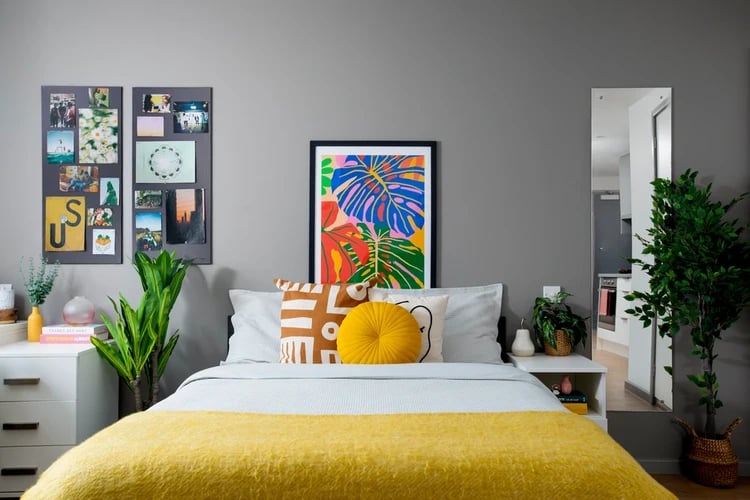 Collage photos framed art yellow bed Bedroom at Brunel House in Bristol Student Accommodation
