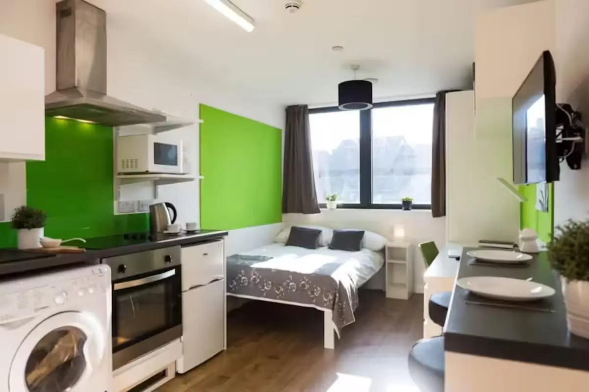 Kitchen bed study area and TV studio apartment at St Lawrence House in Bristol Student Accommodation