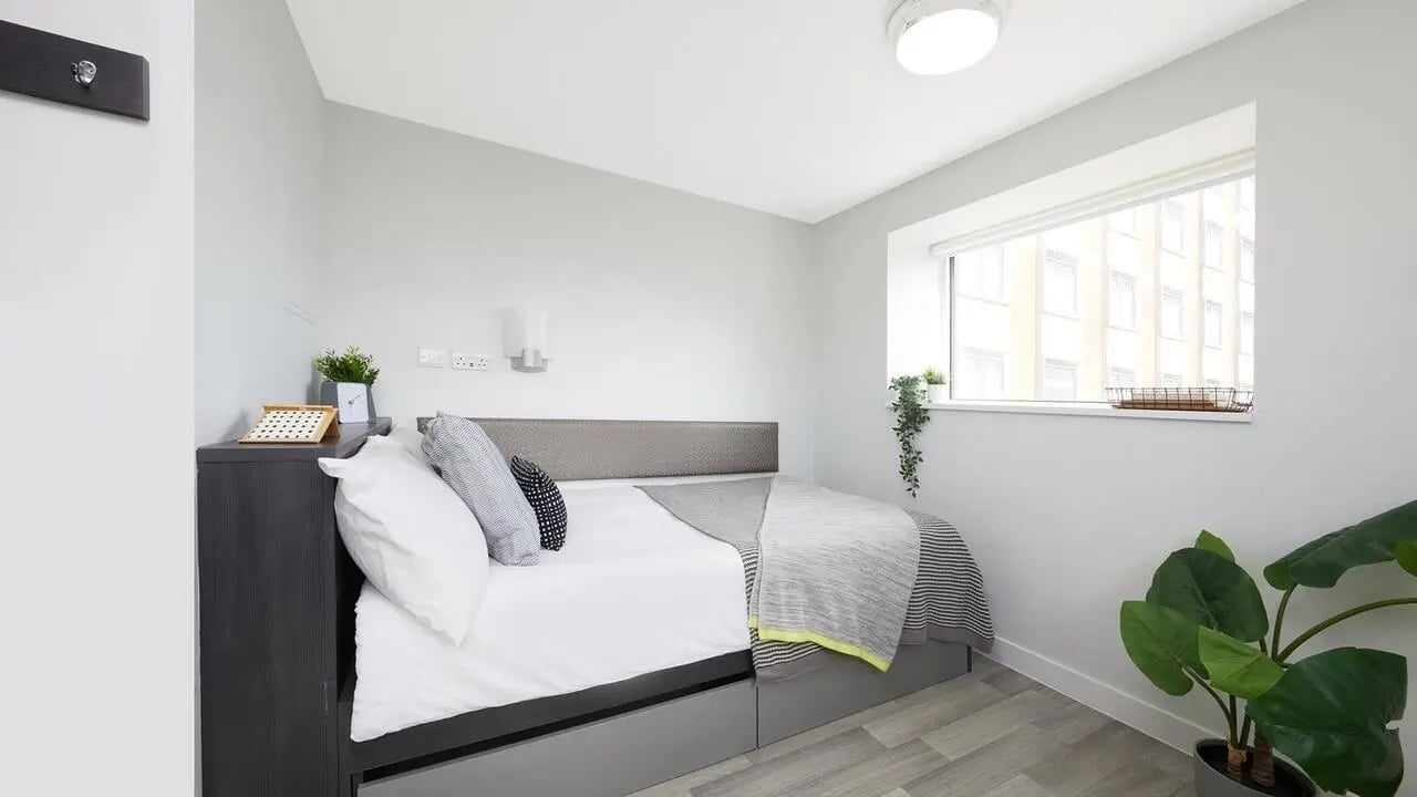 Bed side table and plants bedroom at Collegiate Tower in Bristol Student Accommodation