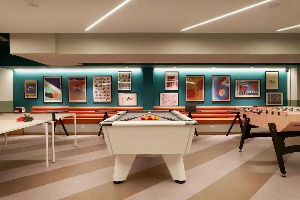 Pool table foosball table and art living room at Culver House in Bristol Student Accommodation