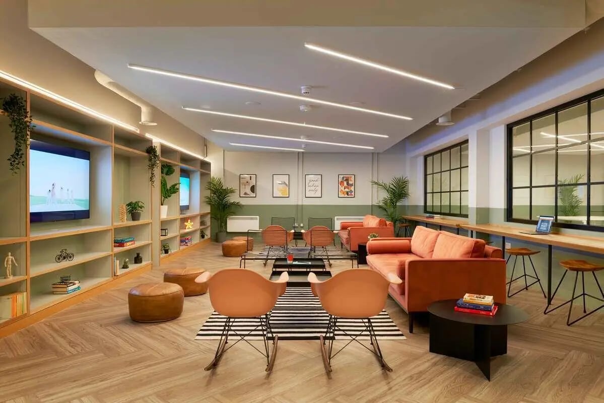 Modern lounge with sofas TV and study area. at Culver House in Bristol Student Accommodation