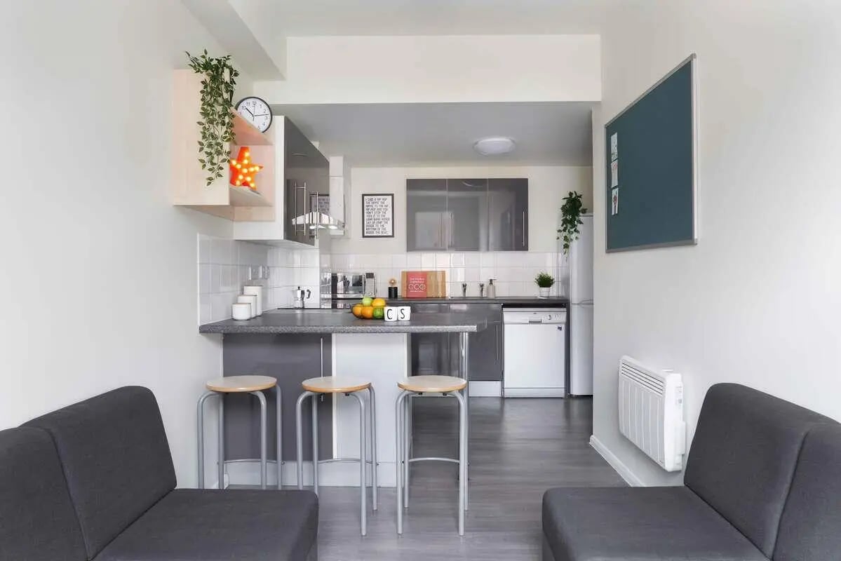 Sofa stools kitchen counter with fruit and fridge kitchen at Culver House in Bristol Student Accommodation