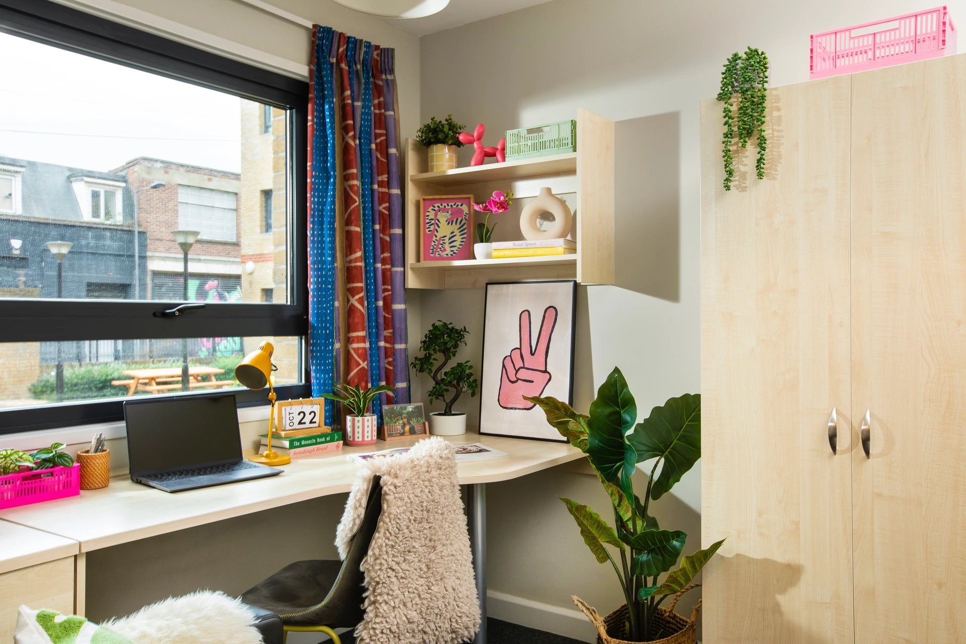 Desk with laptop plants and shelves Study area at Pacific Court in London Student Accommodation