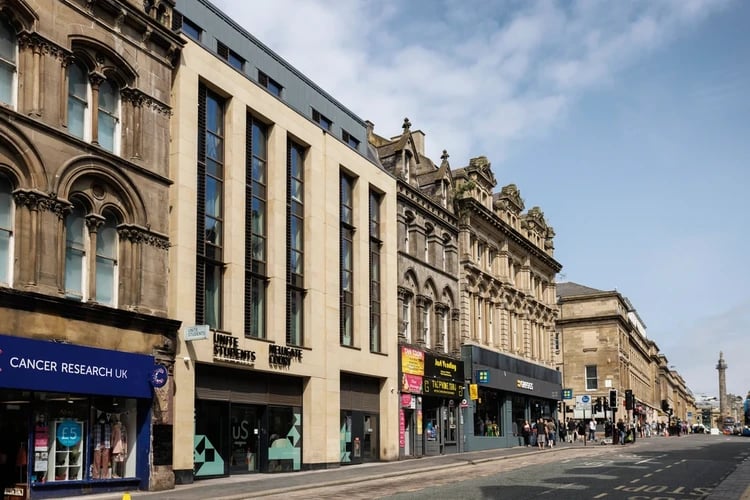 Unite Students building with shops on street exterior at Newgate Court in Newcastle Upon Tyne Student Accommodation
