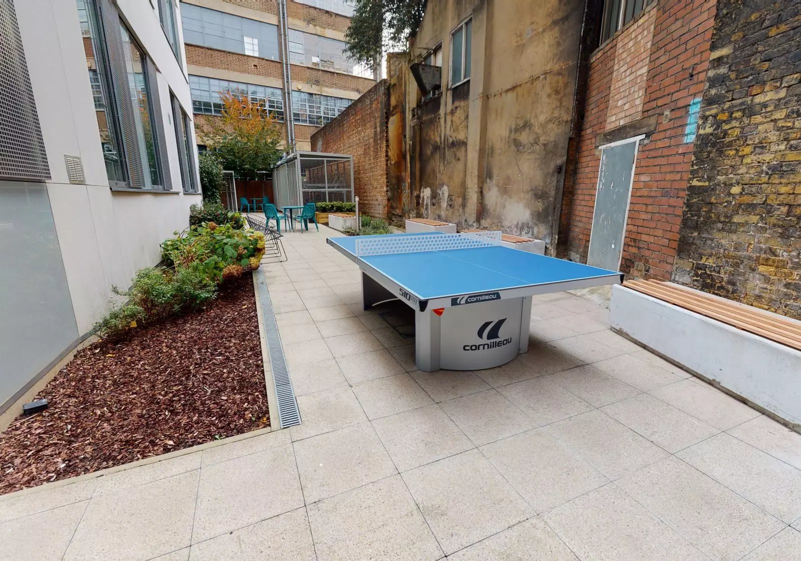 Blue ping pong table with seating area exterior at iQ Bankside in London Student Accommodation