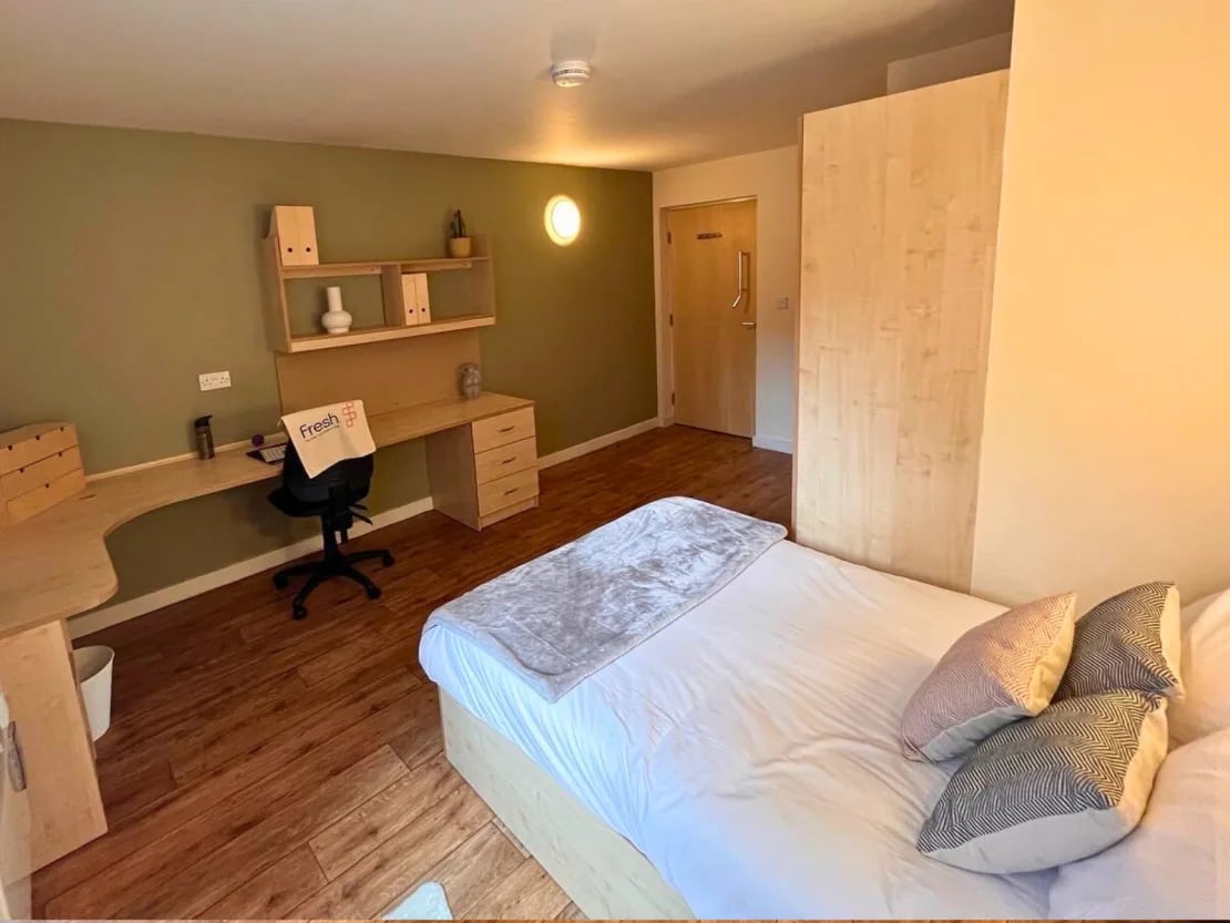 Bed desk and wardrobe student accommodation bedroom at Europa in Liverpool Student Accommodation