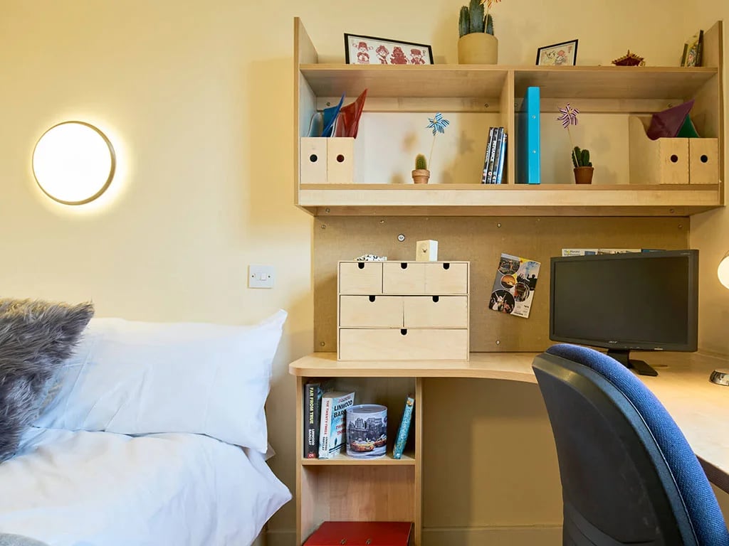 Bed desk shelves and chair study bedroom at Europa in Liverpool Student Accommodation