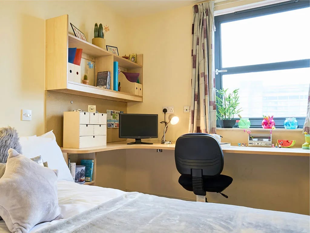 Desk bed shelf computer and window bedroom at Europa in Liverpool Student Accommodation