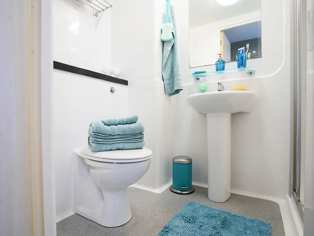 Toilet sink towels and bin bathroom at Europa in Liverpool Student Accommodation