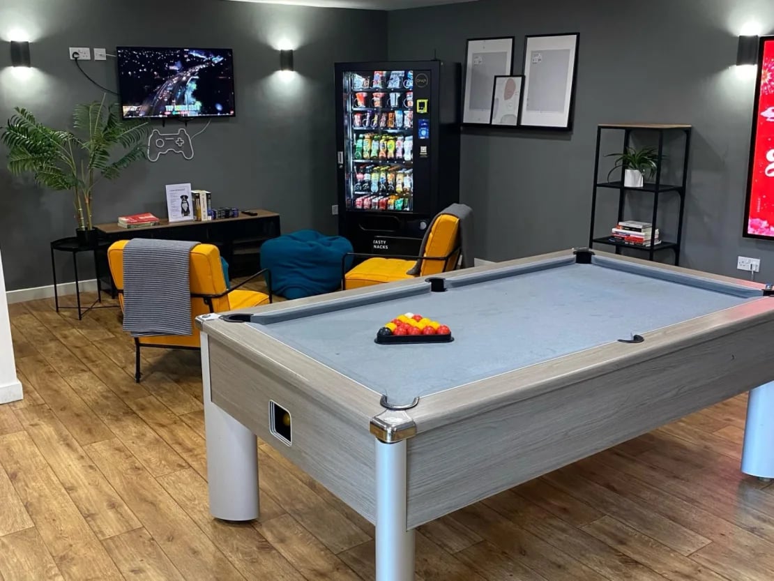 Pool table chairs vending machine games room at Europa in Liverpool Student Accommodation