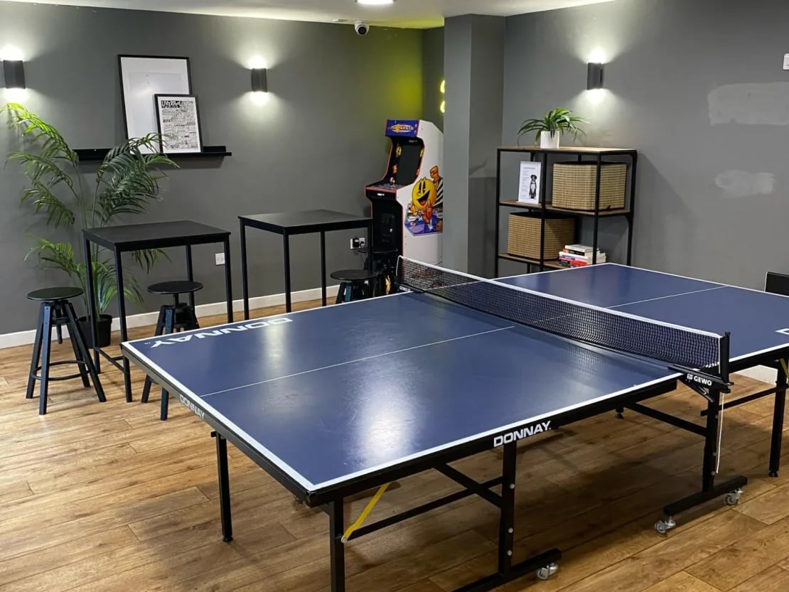 Ping pong table arcade machine bar tables playing area at Europa in Liverpool Student Accommodation