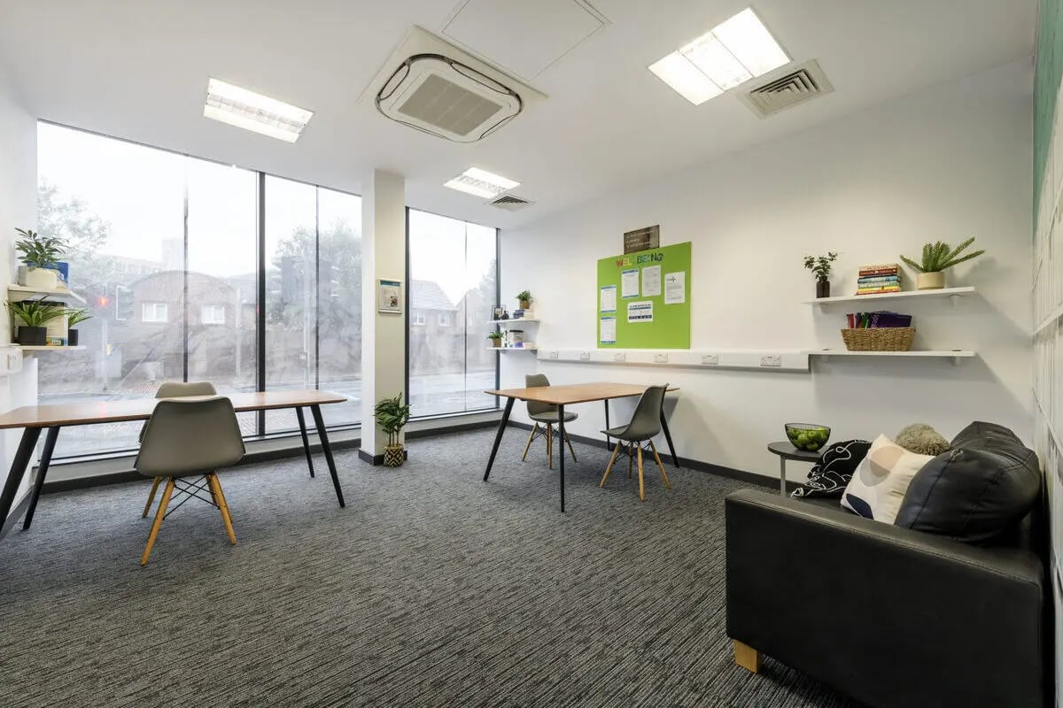 Tables chairs plants and sofa communal area at Glassworks - Liverpool in Liverpool Student Accommodation