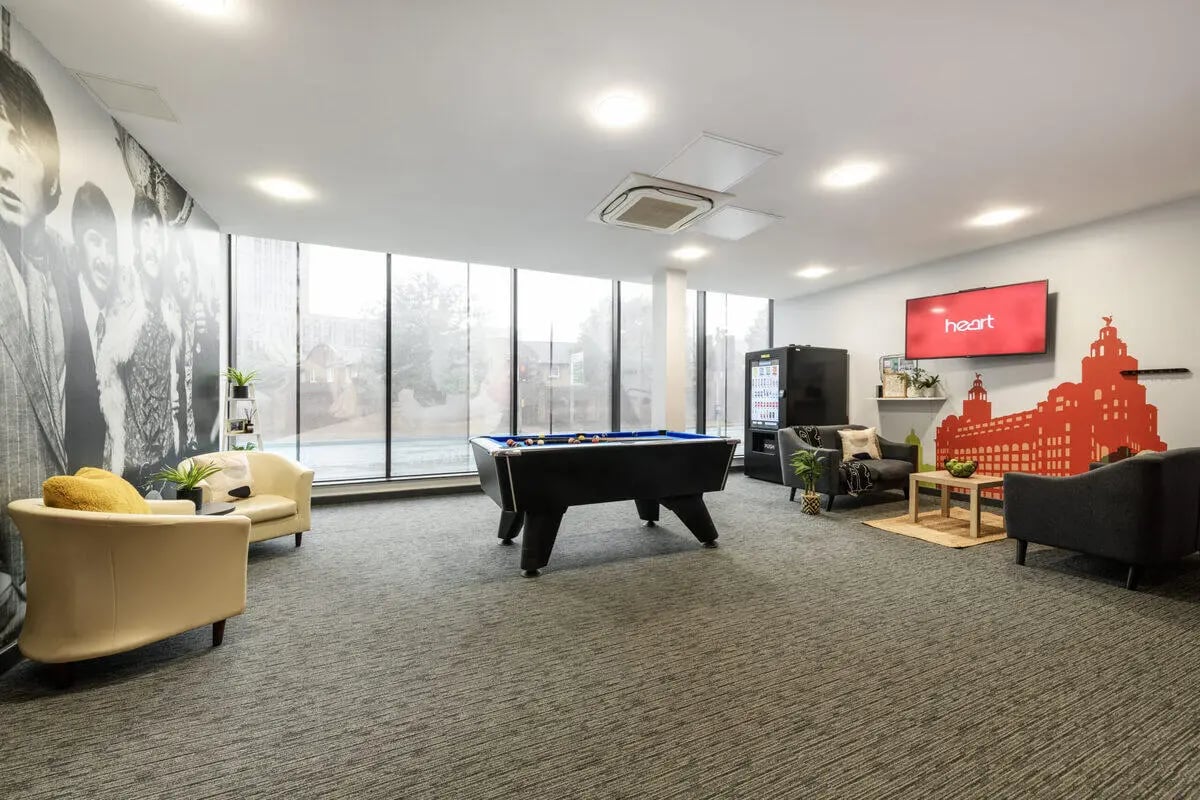 Pool table sofas vending machine television lounge area at Glassworks - Liverpool in Liverpool Student Accommodation