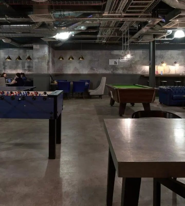 Foosball table pool table blue sofas lounge area at Hope Street in Liverpool Student Accommodation