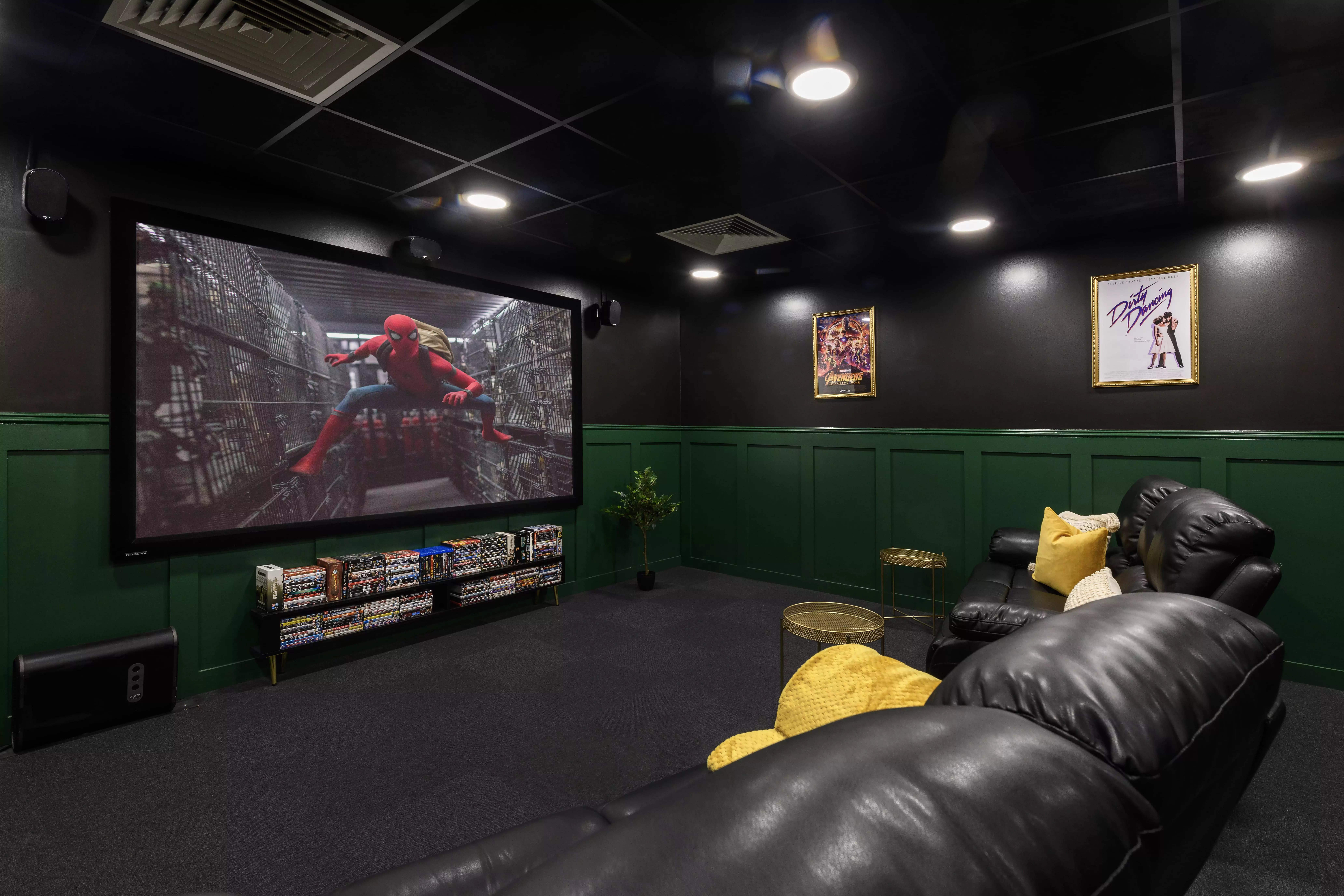 Leather sofas projector screen movie posters entertainment room at Hope Street in Liverpool Student Accommodation